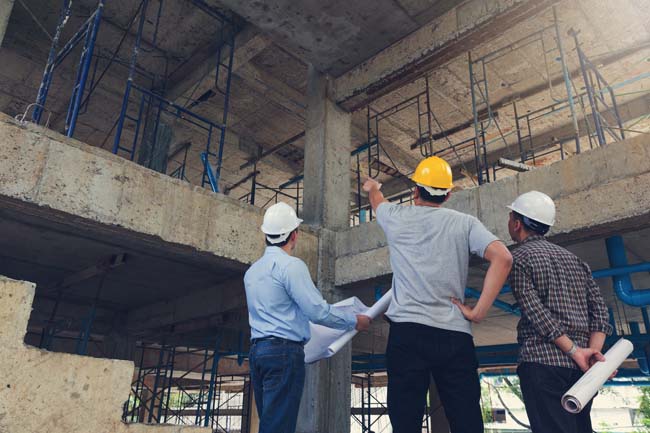 Construction manager inspecting a building